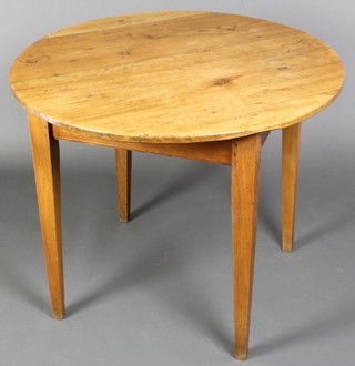 A 19th Century pine and elm circular table raised on square chamfered supports 26"h x 32" diam. 