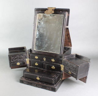 A Chinese hardwood and gilt mounted dressing box, the interior fitted a mirror with sliding compartments above 2 long and 4 short drawers 8"h x 9 1/2"w x 12"d 