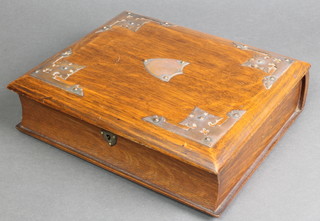 A Victorian cushion shaped oak writing box with metal mounts and fitted interior 3"h x 11"w x 9 1/2"d 