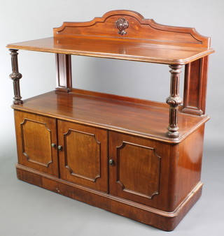 A Victorian rectangular walnut buffet with raised top, the base fitted enclosed by triple panelled doors, the base fitted 2 trays and cellarette drawer 51"h x 55"w x 21 1/2"d