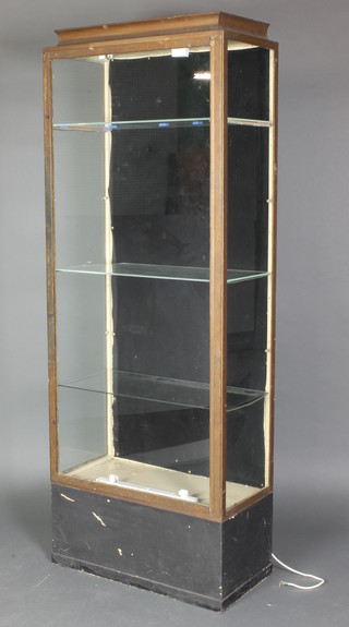 An Art Deco gilt painted metal shop display cabinet with waisted top enclosed by a glazed panelled door 73"h x 28 1/2" x 14 1/2"  
