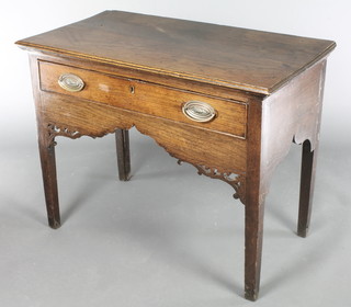 A Georgian oak side table fitted a drawer with pierced and shaped apron raised on pillar supports 28"h x 36"w x 19"d 