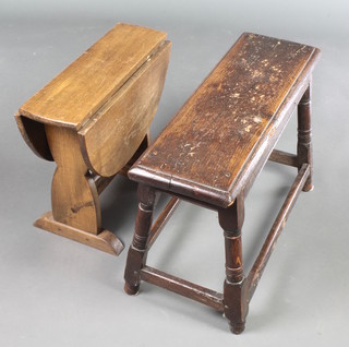A Victorian rectangular oak joined stool raised on turned and block supports 16"h x 27"w x 8 1/2"d  together with an oak oval drop flap occasional table 16"h x 19"w x 5 1/2" when closed x 23 when open 