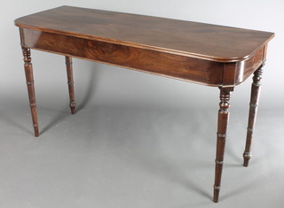 A 19th Century mahogany side table raised on turned supports 30"h x 54"w x 20"d 