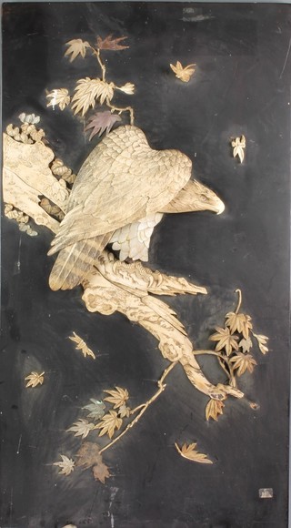 A Japanese rectangular black lacquered and ivory panel decorated a figure of an eagle 30" x 17 1/2"