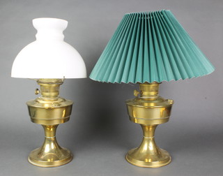 A brass oil lamp with opaque glass shade (chipped) and 1 other, both converted for use to electricity 