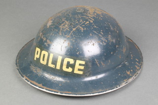 A World War II Policeman's steel helmet, the interior marked YDII HBH 1939 
