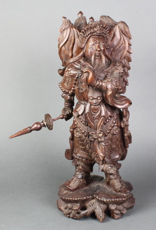 A Japanese carved hardwood figure of a standing warrior with banner 16"