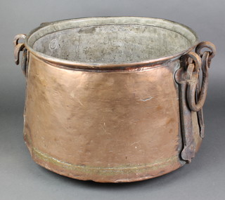 A large Eastern circular copper pot with iron drop handles 13"h x 18" diam.  