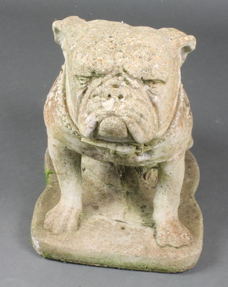 A well weathered composition stone figure of a seated bulldog 16"h x 14"w x 12"d 
