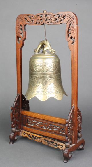 A Japanese carved gilt bronze bell raised on a pierced hardwood stand 18"h x 5" 