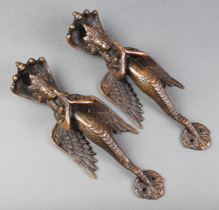 A pair of Eastern door bronze handles in the form of standing temple attendants 11" 