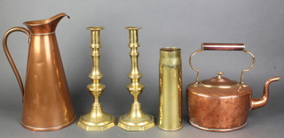 A 19th oval copper kettle 5", some dents, a waisted copper jug the base marked T S & S 13", a pair of 19th Century brass candlesticks with ejectors 12", a brass shell case and 3 pokers 
