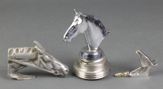 A chrome car mascot in the form of a horses head, ditto cast aluminium and 1 other ornament in the form of a horses head