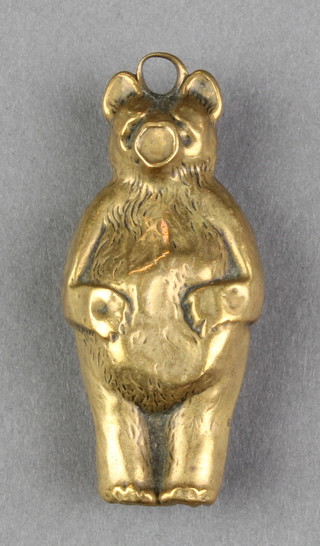 A child's brass rattle in the form of a bear 2 1/2" (some dents)
