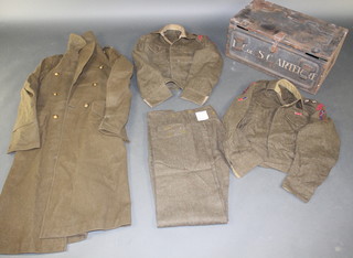 A George VI Royal Engineers Lieutenant Colonels ( S C Arter ) Great Coat together with 2 ditto battle dress blouses and 1 pair of trousers contained in a WWII ammunition tin marked Lay/C1 1942
