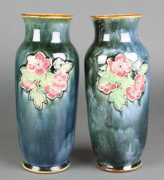 A pair of Royal Doulton oviform vases the blue ground decorated with sprays of flowers 10" 