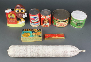 A Huntley & Palmer Hippodrome shop display biscuit bar, with a Canadian Beauty pink salmon display tin, a Mi-Boy salmon display tin, a Heinz Christmas plum pudding display tin, a Diploma crustless cheddar cheese display round, a Creamola display box, a model of a German sausage 16", together with a Sun-Maid raisin plastic money box 