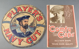 A 1930's cardboard Comfy Cap shop display sign 12" x 8" (slightly dogeared) together with a Player's Navy Cut box lid (cut to the life ring and with split to the back) 12"
