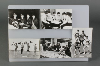 15 various black and white postcards of The Beatles and a 1964 Mirabelle black and white group photograph of The Beatles 