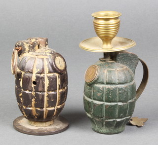 A Mills hand grenade no. 36 converted for use as a table ornament together with 1 other possibly a training  grenade converted for use as a chamber stick 