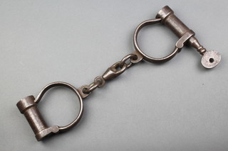 A pair of military issue heavy gauge handcuffs marked S W D M & SN Aligap C-630 1944