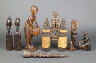 A carved African hardwood figure of a standing lady 12" and other carved wooden figures