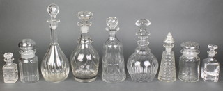 A cut glass mallet shaped decanter and stopper 12", 4 other decanters and 4 lidded bottles 