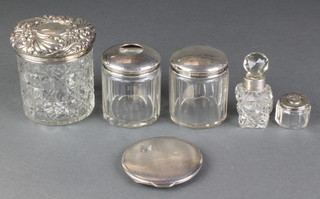 A silver mounted hair tidy London 1920, 3 toilet bottles, a scent and a compact 