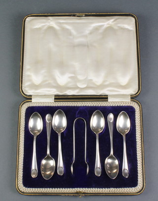 A set of 6 silver teaspoons and nips with fancy handles, cased,  Sheffield 1915, 20 grams 