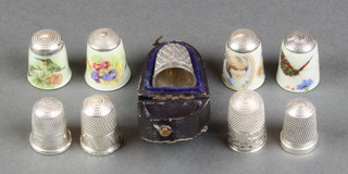A cased silver thimble and  8 others 