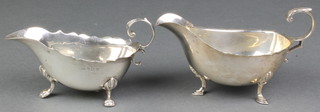 An Edwardian silver sauce boat Birmingham 1901, a later ditto Sheffield 1932, 204 grams