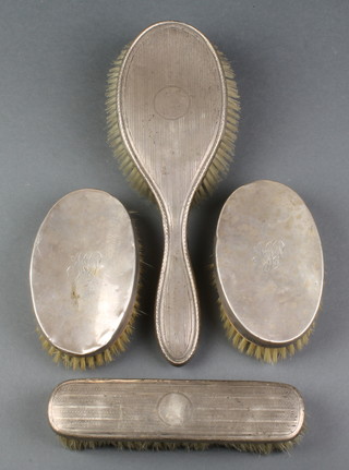 A pair of silver hair brushes, Birmingham 1918, a clothes brush and hair brush