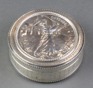 An early 20th Century French repousse silver box depicting a scene of a lady golfer Ostend Golf Club 3", 110 grams