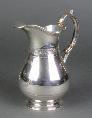 A Victorian chased silver baluster jug with armorial, scroll handle and ivory resistors 14 ozs, 7" 