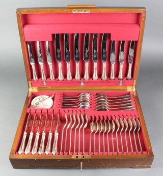 A set of silver plated cutlery for 12 contained in a walnut canteen