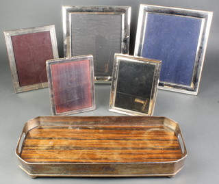An octagonal silver plated tray with rosewood base 18" together with minor plated photograph frames