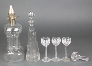 A silver mounted decanter and stopper 12", a tapered flask, 3 liqueurs and a stopper 