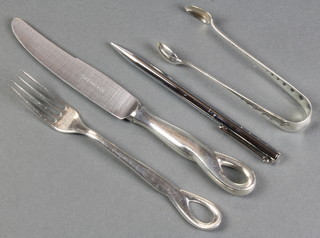 A pair of Tiffany & Co sterling sugar nips, a ditto propelling pencil and a knife and fork 