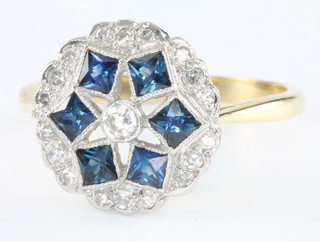 An 18ct yellow gold sapphire and diamond cluster ring size P 1/2