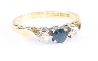 An 18ct yellow gold sapphire and diamond ring size J 1/2