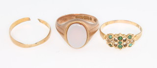A 9ct yellow gold signet ring, size R, a 15ct gem set ring size S and a 9ct wedding band size S