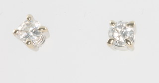 A pair of white gold diamond ear studs, each approx. 0.10ct 