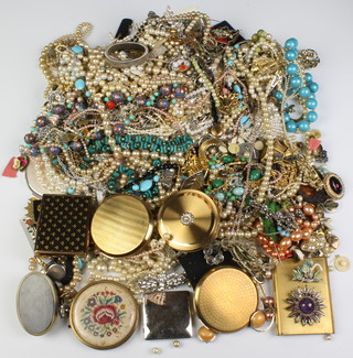 A large quantity of costume jewellery and compacts etc 
