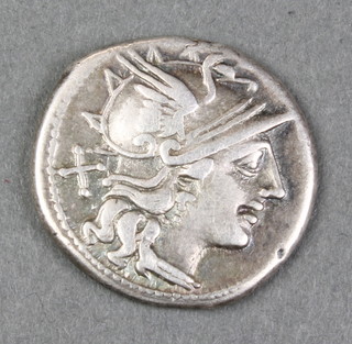 A Roman silver coin bearing a chariot and 2 horses and a bust of a warrior 3/4" 