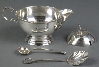 A silver cream jug Birmingham 1932, 2 spoons and a jar lid 156 grams
