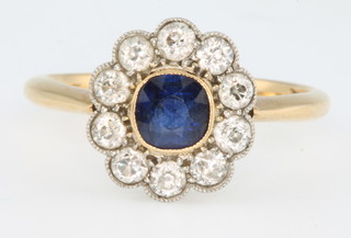 A yellow gold sapphire and diamond cluster ring, size N 