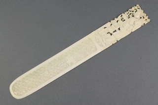 A carved Cantonese ivory page turner, the handle in the form of a lady and child 9 1/2" 