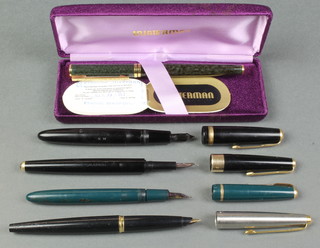 A Parker 17, a ditto Duofold, a Black Parker 45 and a green Parker fountain pen together with a Waterman marbled fountain pen