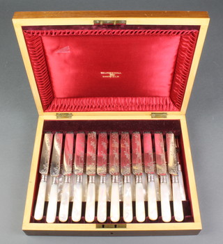 A set of 12 chased silver plated and mother of pearl dessert eaters in a fitted box by Walker and Hall 